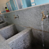 Myles of Great Hopes image of water taps in Ilbissil